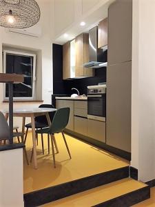 a kitchen with a table and a dining room at Casa Oliva Cinque Terre in Manarola