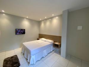 Mega Aeroporto Hotel Apenas 1 km de distância do Aeroporto de Fortaleza客房内的一张或多张床位