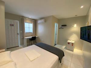 Mega Aeroporto Hotel Apenas 1 km de distância do Aeroporto de Fortaleza客房内的一张或多张床位