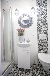 Kúpeľňa v ubytovaní Apartamenty Centrum