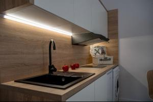 Kuchyňa alebo kuchynka v ubytovaní Apartamenty Centrum