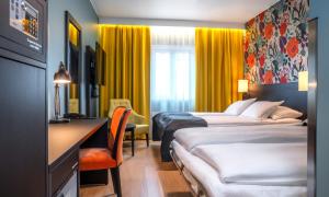 Postel nebo postele na pokoji v ubytování Thon Hotel Harstad