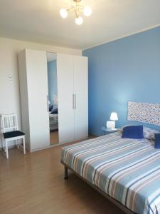 מיטה או מיטות בחדר ב-Riva al Mare Flat
