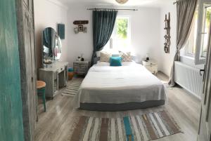 a bedroom with a large bed and a mirror at Casa Santa in Sighişoara