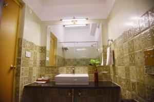 Koupelna v ubytování Hotel Coorg International