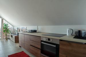 a kitchen with a stove and a counter top at Apartment L Palace in Budva