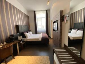 Postel nebo postele na pokoji v ubytování Hotel De Boskar Peer