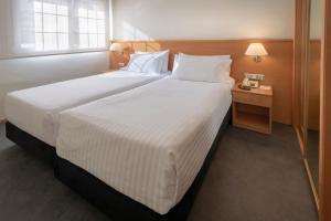Łóżko lub łóżka w pokoju w obiekcie Apartments Playa de Castelldefels