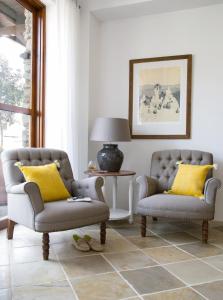 two chairs and a lamp in a living room at Casale Panayiotis in Kalopanayiotis