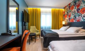 Postel nebo postele na pokoji v ubytování Thon Hotel Harstad