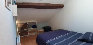Postel nebo postele na pokoji v ubytování Le gîte de l'atelier