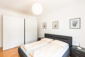 Postel nebo postele na pokoji v ubytování Ferienwohnung St. Pölten Rathausplatz