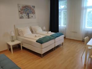 Posteľ alebo postele v izbe v ubytovaní 1210Apartment
