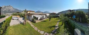 a car parked in a yard next to a house at Casa Maria Apartments in Riva del Garda