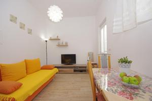 Predel za sedenje v nastanitvi Apartments Silva