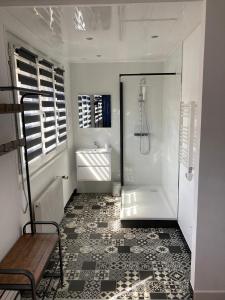 a bathroom with a shower and a sink at Le Treize-Mer in Le Portel