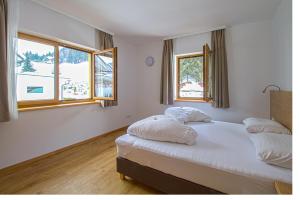 Postel nebo postele na pokoji v ubytování Hotel Sonnleitn