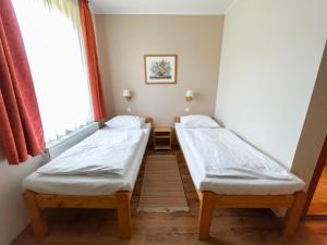 Postel nebo postele na pokoji v ubytování Anna Panzió