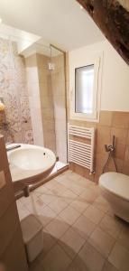 a bathroom with a tub and a toilet and a sink at Due balconcini sul mare in Santa Margherita Ligure