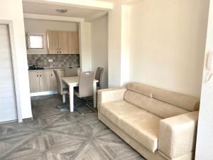 a living room with a couch and a table at Villa Casanego in Sutomore +52 photos