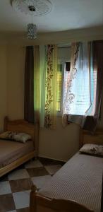 Postel nebo postele na pokoji v ubytování Appartement Mus saidia 1