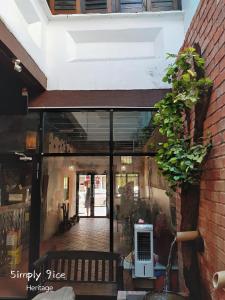 a building with a large glass door with plants at 5imply 9ice Heritage in George Town