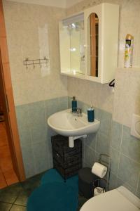 Ванна кімната в Apartman De Luxe