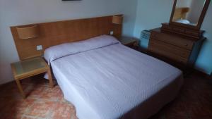 A bed or beds in a room at Montes de Alvor - Bloco C-1-10