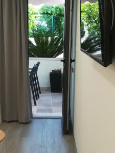 TV a/nebo společenská místnost v ubytování Apartmani Vidoš