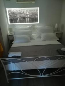 Postel nebo postele na pokoji v ubytování Apartmani Vidoš