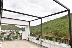 a view from the balcony of a house with mountains in the background at Sơn Hà Hotel in Quy Nhon