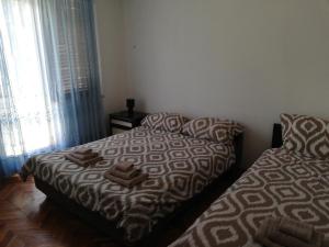 Postel nebo postele na pokoji v ubytování Apartments Ivo