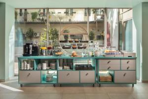 A kitchen or kitchenette at Cortile Hotel - Adults Only