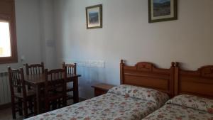 
Cama o camas de una habitación en Alojamiento Rural Sierra de Gudar
