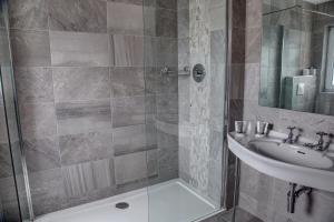 a bathroom with a shower and a sink at The Orwell Hotel in Felixstowe