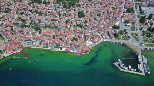 arial view of a city with boats in the water at House Lucija in Ohrid