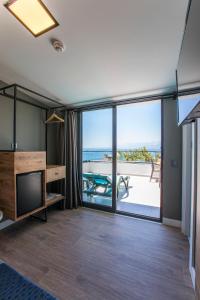 a living room with a view of the ocean at Pure Blanche Hotel in Antalya