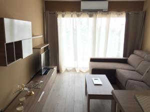 a living room with a couch and a table at Apartamento Vista Mar 410 in Port d'Alcudia