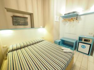 Llit o llits en una habitació de Hotel La Spiaggia