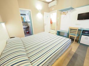 Llit o llits en una habitació de Hotel La Spiaggia