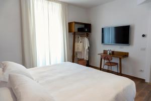 A bed or beds in a room at Il Caruggio Rooms&Breakfast