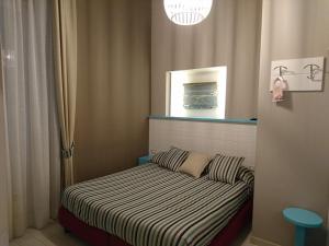 Llit o llits en una habitació de Hotel La Spiaggia