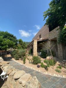 a stone house with a stone walkway at Hotel gite d'etape San Pasquale in Conca +11 photos