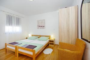 A bed or beds in a room at Apartments Silva