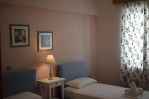 Postel nebo postele na pokoji v ubytování Eleonora apartment no2