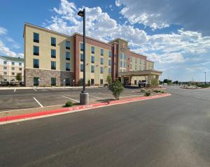 an empty street in front of a large building at Comfort Suites Midland West in Midland