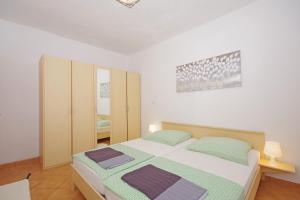 Postelja oz. postelje v sobi nastanitve Apartments Silva