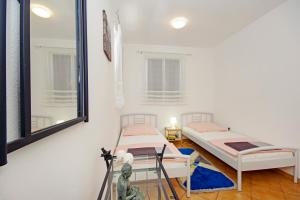 Postelja oz. postelje v sobi nastanitve Apartments Silva