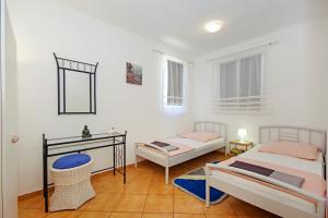 Postelja oz. postelje v sobi nastanitve Apartments Silva