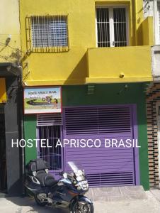 a motorcycle parked in front of a building at Hostel Aprisco Brasil in Sao Paulo